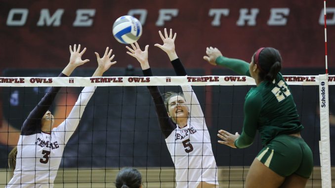 Jennifer Iacobini (left) and Dara Peric (right) successfully close a block against South Florida's Priscilla Ehieze in Temple's 3-0 win against the Bulls. | Hua Zong TTN