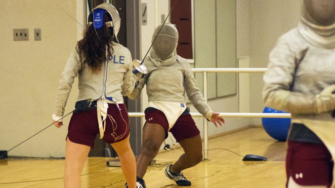 Junior sabre Gloria Aguilar practices against teammate Victoria Super last Thursday. | Margo Reed TTN