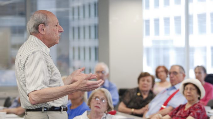 Members of Temple’s Osher Lifelong Learning Institute listen to a lecture in a classroom. | COURTESY Adam Brunner