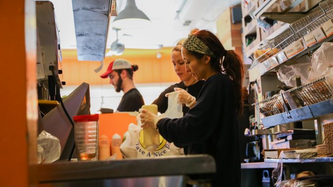 Manager Brandon Hopkins and employees Amy Shirk and Megan Chambers work at Fairmount restaurant, Rybread. Jenny Kerrigan |TTN