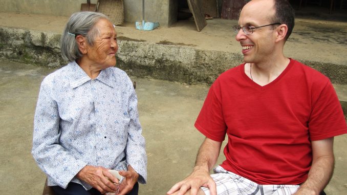 Liu Chenggui, 85, sits with John Smagula. Chenggui lives in the village of Tongzigou, 10 miles away from Shuya, China. | COURTESY John Smagula