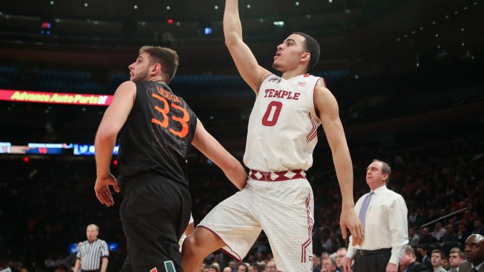 Freshman forward Obi Enechionyia (right) finished with a career-high 17 points, eight rebounds and five blocks Tuesday night to pace the men's basketball team, but the Owls fell just short in a 60-57 loss to Miami in a National Invitation Tournament semifinal matchup. | Jenny Kerrigan