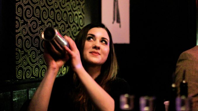 Allison Hangen of The Olde Bar mixes a signature cocktail, the “Meyer Lansky,” at the Trestle Inn’s Bourbon Battle. | Harrison Brink TTN