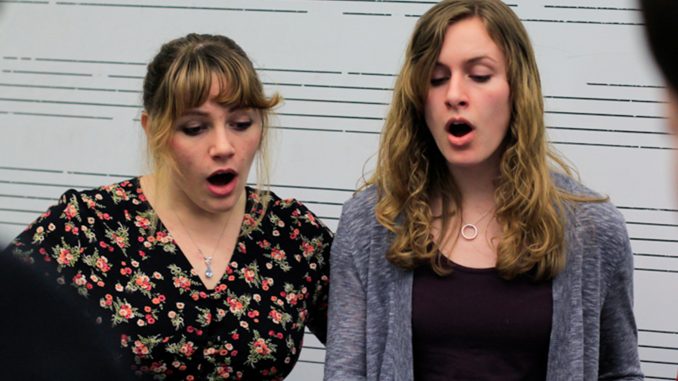 Sophomore Holleigh Christie (left) and freshman Kristin Stidham rehearse Billy Joel’s “I’ve Loved These Days” in Presser Hall on March 17. | Harrison Brink TTN