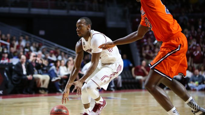 Senior guard Will Cummings (left) looks to gain possession of the ball in Temple's 73-67 win against Bucknell Wednesday night. Cumming netted a season-high 30 points in his team's first victory in a National Invitation Tournament since 2003. | Jenny Kerrigan TTN