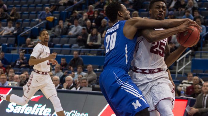 Owls junior guard Quenton DeCosey (right) attempts to drive past Memphis junior guard Avery Woodson in Temple's 80-75 defeat of the Tigers Friday in an American Athletic Conference tournament quarterfinal. DeCosey finished with 14 points and a team-high eight rebounds. | Donald Otto TTN