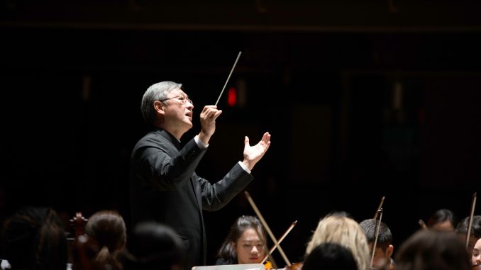 Provost Hai-Lung Dai (right), senior vice president for academic affairs, has conducted music across the world while balancing his career. | COURTESY Hai-Lung Dai