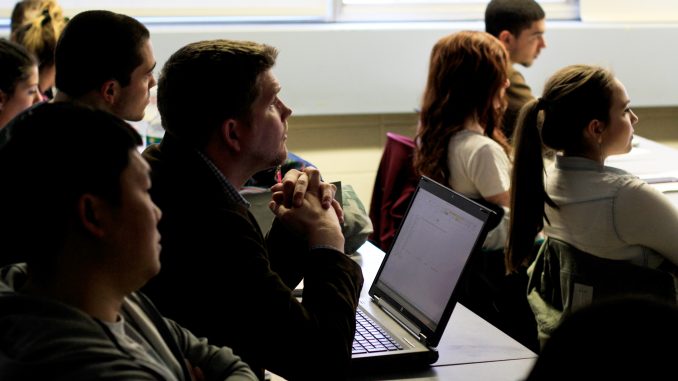 Professor Jonathan Latko listens to a presentation by student Theresa Smurkowski in his Marketing for Sustainable Enterprise class on April 2. the Sustainable Enterprise class on Thursday, April 2. | Harrison Brink TTN