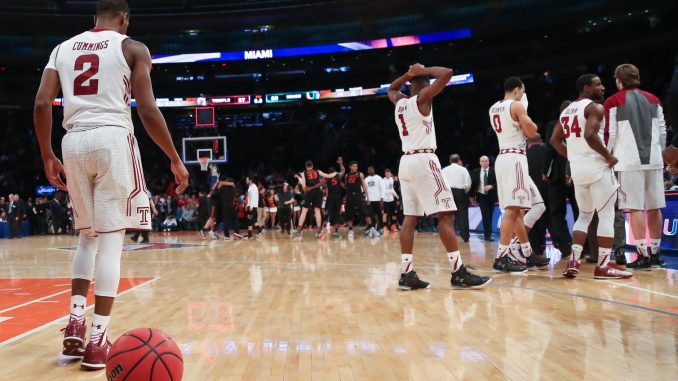 The men’s basketball team walks off the court at Madison Square Garden after the squad’s 60-57 loss to the University of Miami in the National Invitation Tournament semifinal last Tuesday. | Jenny Kerrigan TTN