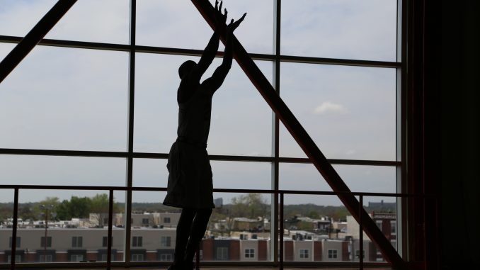 Former team captain and senior guard Will Cummings practices his three-point shots in the McGonigle Hall practice facilities last Friday. | Jenny Kerrigan TTN