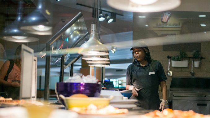 Arnessa Smith works at the Saffron Grill, a Halal station that was added to the Valaida S. Walker Food Court this summer. | Margo Reed TTN