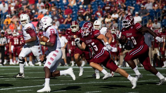 Junior quarterback P.J. Walker evades a UMass defender during the Owls 25-23 win Saturday at Gillette Stadium. | Jenny Kerrigan TTN