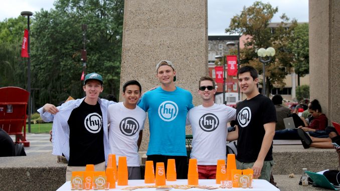 Temple’s Hangify representatives Kevin Foster (left), Daniel Garton, Ethan Dombroski, Jack Sheerin and Ben Math promote Hangify at the Bell Tower last Friday. | Madeline Archambault TTN