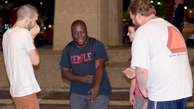 Bobby Clancy (left) and Irv Jean-Baptiste freestyle by the Bell Tower, as part of Freestyle Friday, a weekly event. The event was started by rapping duo and alumni The Hungry Ghosts. | Ryan Kuna TTN