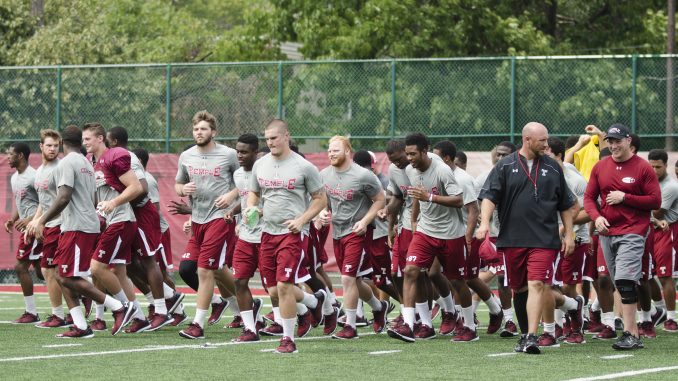 The football team runs off Chodoff Field after a recent practice. The team opens up its season against Penn State Sept. 5 at Lincoln Financial Field. | Margo Reed TTN