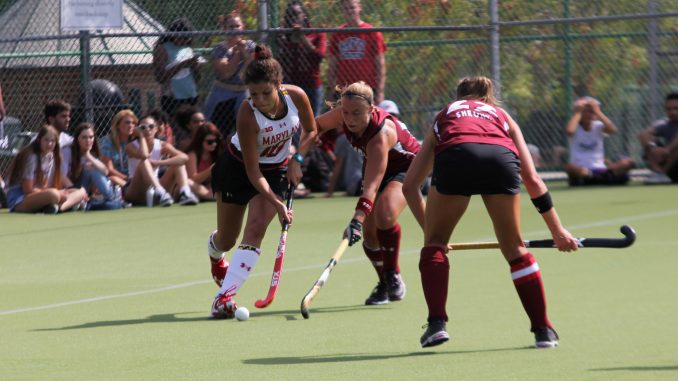 Senior Taylor Shronk (right) and senior Rachel Steinman (left) defend for the Owls against the University of Maryland Friday. | Greg Van Buskirk TTN