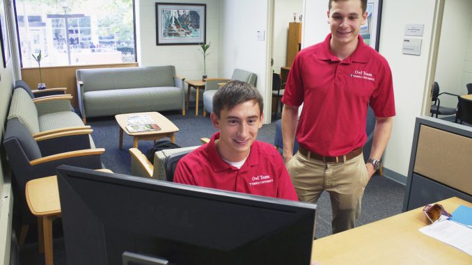 Christopher McFadden (left), and Zach Mullen, Owl Team Leaders, discuss the course future members will be required to complete to work for the university next year. | Joshua Dicker TTN