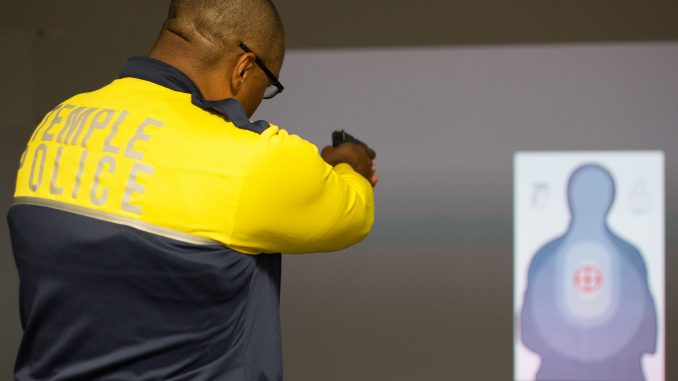 Temple Police officer Damon Mitchell tests the new Ti Training simulator. | Daniel Rainville TTN