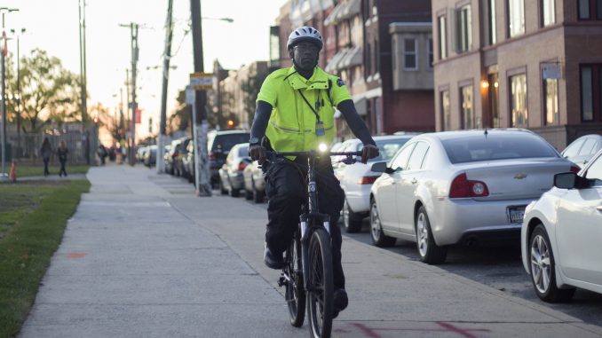 AlliedBarton Bike Officer Lamar Gargile bikes down Norris Street in his patrol zone Oct. 10. Gargile has been a bike officer for the past three years. | Jenny Kerrigan TTN