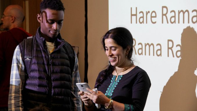 Mangal-Aarti Devi Dasi (right), one of the organizers of the Bhakti Yoga Club, talks to students about the club’s programs Oct. 1. | Daniel Sebastian TTN