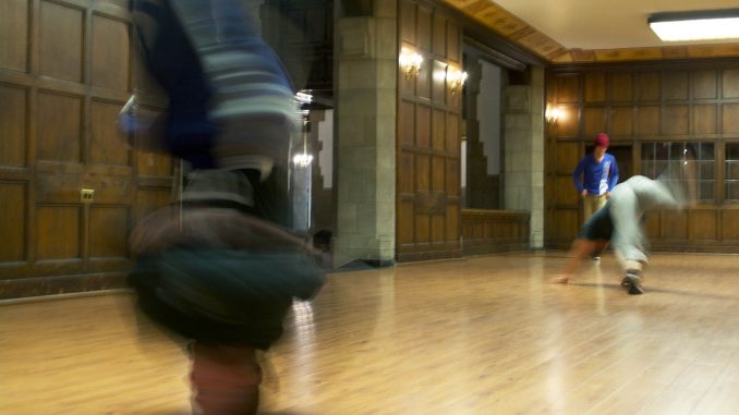 Dejan Majerle (left), headstands at Temple’s Bboy team’s practice in Mitten Hall. | Khanya Brann TTN