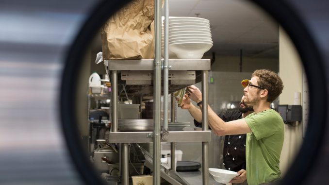 Alex Long works in the kitchen during staff training at Front Street Café. | Margo Reed TTN