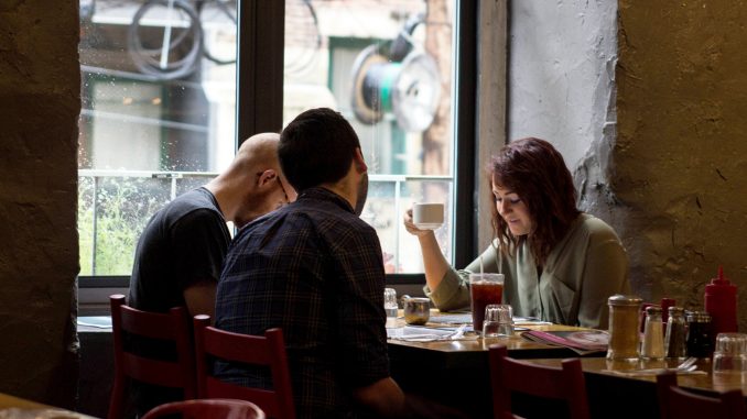 Amanda Woodward, (right), dines with friends Thomas Krauss and Sean Cassidy at Café Lift, a brunch spot in Center City that expected more customers. | Patrick Clark TTN