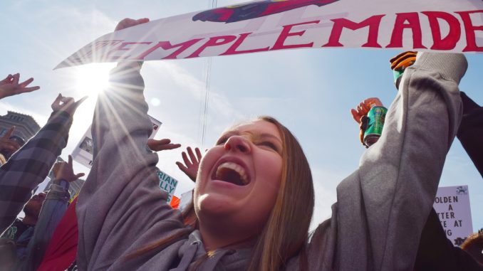 Jordan Stewart raises her “Temple Made” sign at ESPN’s College GameDay Oct. 31 at Independence Hall. | Geneva Heffernan TTN