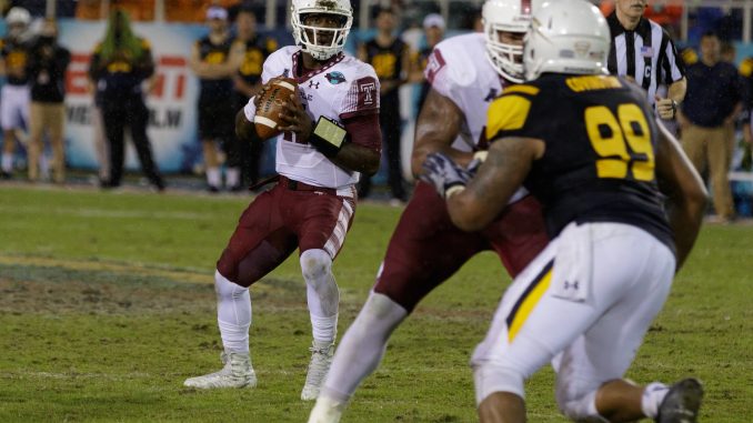 Junior quarterback P.J. Walker stands in the pocket during the fourth quarter of Temple's 32-17 loss to Toledo Tuesday night in the Marmot Boca Raton Bowl in Boca Raton, Florida.| Donald Otto