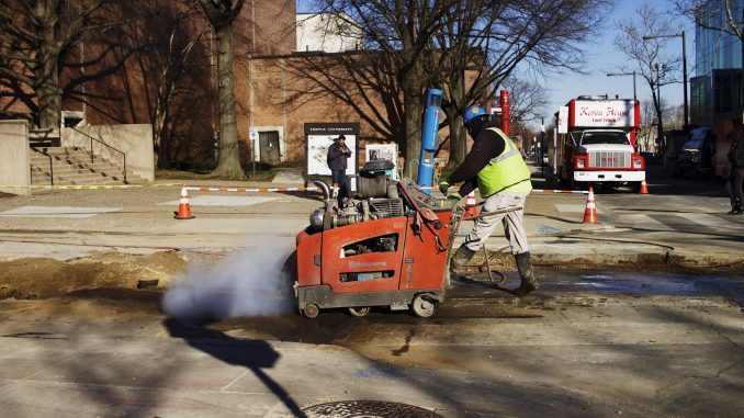 A construction worker digs up part of Norris Street near 13th earlier this week. | Joshua Dicker TTN