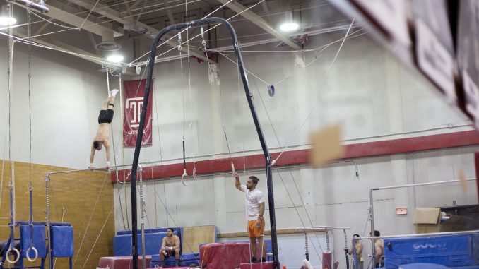 Members of the men's club gymnastics team practice Wednesday afternoon in Gymnasium 143 of McGonigle Hall. Temple Police said the gym was vandalized this past Saturday. | Jenny Kerrigan TTN