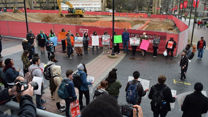 Students and community members gather on Liacouras Walk to protest the proposed on-campus stadium Tuesday March 15, 2016. | GENEVA HEFFERNAN TTN