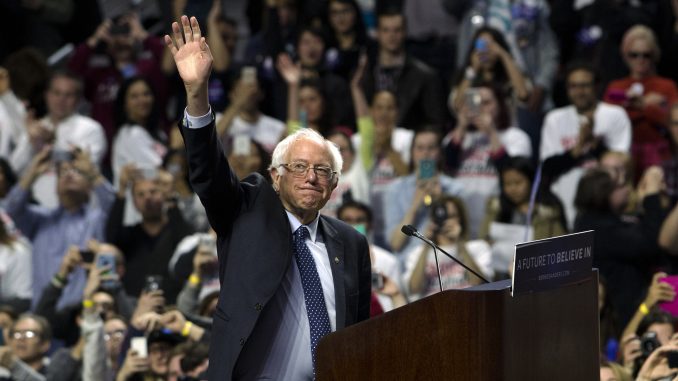 Presidential candiate Bernie Sanders waves to the crowd in the Liacouras Center Wednesday night. | JENNY KERRIGAN TTN