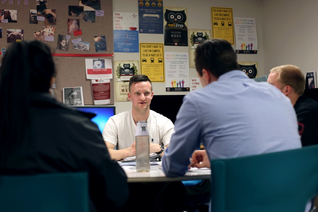 Jake Schlottman speaks to a group of students at a Unicovery meeting in the Wellness Resource Center.